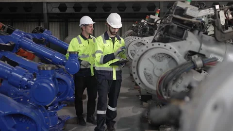 Engineer work at robotic arm factory. Stockbeeldmateriaal 244561679