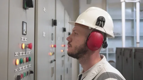 Engineer in a work suit and helmet checks the readings of sensors Stock Footage 116677388