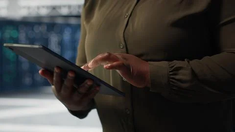 Engineer at work using green screen laptop in data center to check hardware Stock Photos