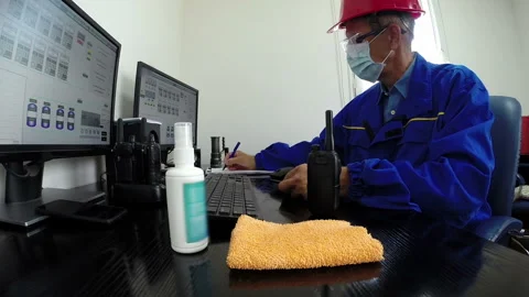 Engineer at Work Wearing Protection Face Mask and Eyeglasses Against Coronavirus Stock Footage 169365782