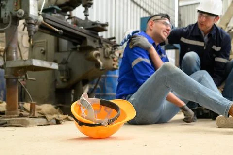 Engineer worker with accident at factory Stock Photos