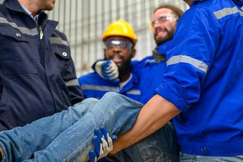 Engineer worker with accident at factory Stock Photos