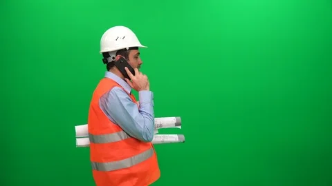 Engineer Worker With Blueprints Talking With Cell Phone, Green Screen Background Stock Footage 88660737