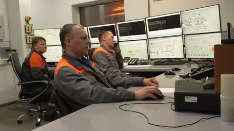 Engineer worker at the control desk in the wood processing industry. Stockbeeldmateriaal 297348680