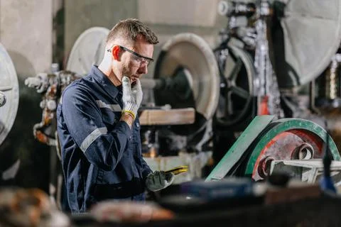 Engineer Worker Man Look and Thinking Wonder to Solve Machine Problem Hand .. Stock Photos