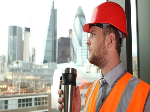 Engineer Worker Man Rest Drink Hot Coffee Look Out Office Window London Skyline Stock Footage 73600392