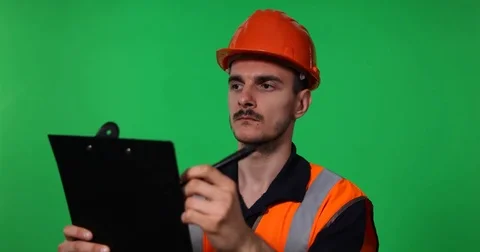 Engineer Worker Man Work Taking Notes on Clipboard Looking Out Job Green Screen Stock Footage 83393063