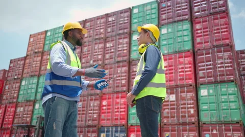 Engineer worker shake hand in the container yard Stock Footage 197549320