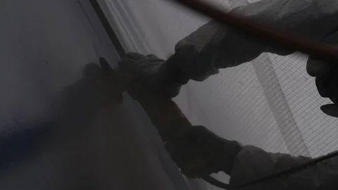 Engineer worker using sander machine for sanding metal surface of boat Stock Footage 116511546