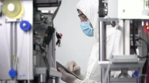 Engineer worker wearing ppe suite, face protective mask, glove useing digital Stock Footage 141410182
