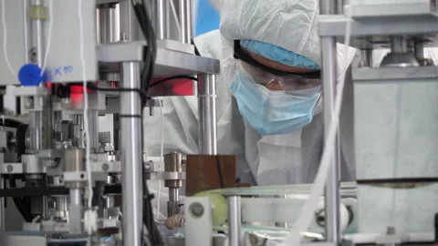 Engineer worker wearing ppe suite; face protective mask; glove; analyze; oper Stock Footage 141410291