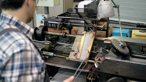 An engineer, a worker working on a milling machine. Manufacture of cutting tools Stock Footage 171775613