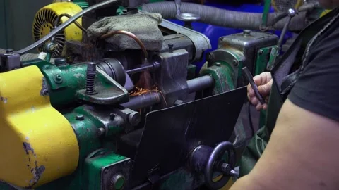 An engineer, a worker working on a milling machine. Manufacture of cutting tools Stock Footage 171776649