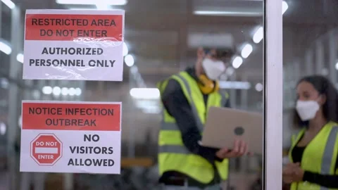 Engineer workers with face mask protection checking and adjusting machine. Stock Footage 154918279