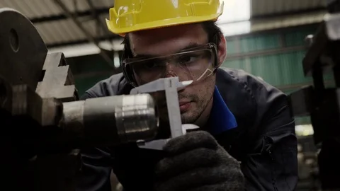 Engineer workers wear a yellow safety helmet, use tools to check and repair Stock-Footage 125129816