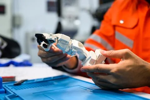 Engineer working and solving problems on machine at industrial plant Foto stock