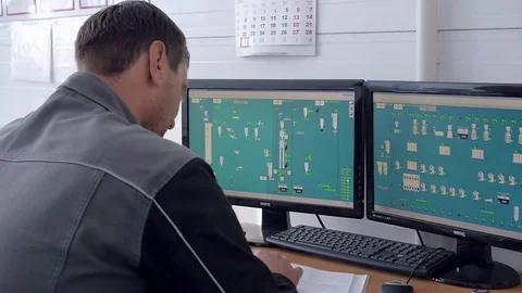 Engineer is Working in CAD Programm on two monitors production 스톡 동영상 70688396