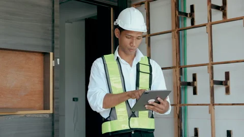Engineer working check and work on tablet at construction site Stock Footage 238369971