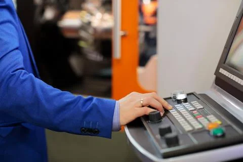 Engineer working with CNC control console Stock Photos