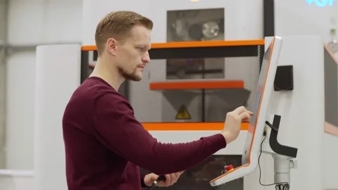 Engineer working on cnc milling machine in lab Stock Footage 142160435