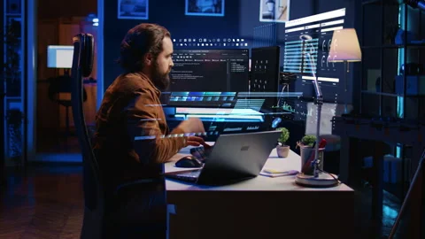 Engineer working on computer and laptop, using AR to do coding, drinking coffee Stock Footage 280123705