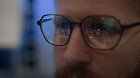 Engineer Working on Computer with Codes Reflecting in Glasses Stock Footage 334933443