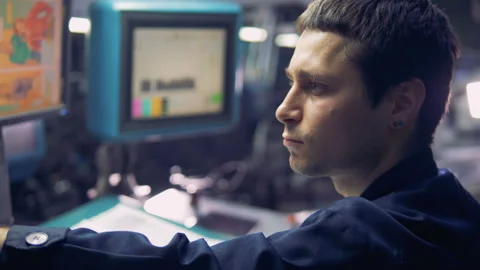 Engineer working with computer touchscreen, checking a ready-mady newspaper. Stock Footage 87246176