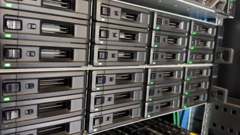 Engineer working in a data center. Hard drive insert.  many hard drives and.. Video stock 250812228