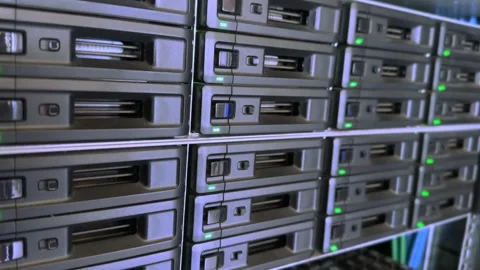 Engineer working in a data center. Hard drive insert.  many hard drives and.. Stock Footage 250812241