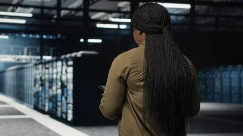Engineer working in data center managing and optimizing network Stock Photos