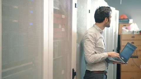 Engineer Working In Data Room.In the System Control Room IT Administrator. 動画素材 104179443