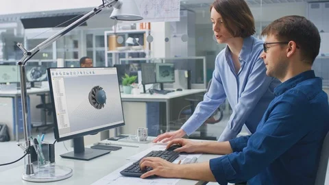 Engineer Working on Desktop Computer, Screen Showing CAD Software with 3D Detail Video stock 107790720