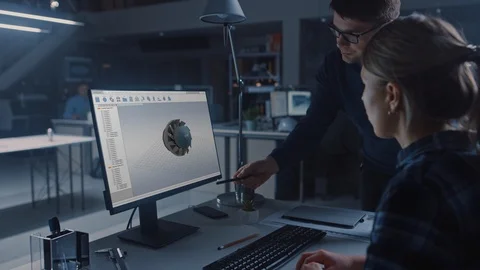 Engineer Working on Desktop Computer, Screen Showing CAD Software with 3D Engine Video stock 107804875