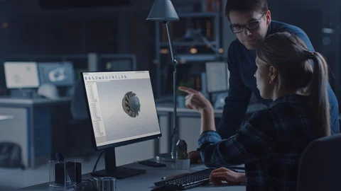 Engineer Working on Desktop Computer, Screen Showing CAD Software with 3D Engine Video stock 107804990