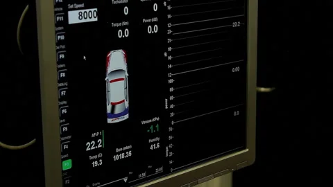 Engineer Working on Desktop Computer, Screen Showing CAD Software with Car Video stock 133375897