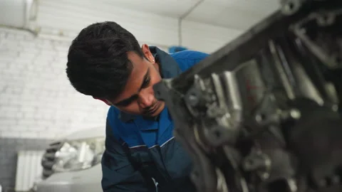 Engineer Working on Engine Block in Automotive Workshop Video stock 301249493