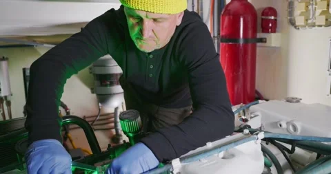 Engineer Working on Engine in Ship's Engine Room Stock Footage 323739650