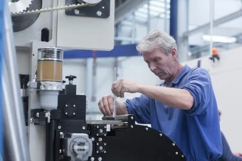 Engineer working in engineering plant Stock Photos