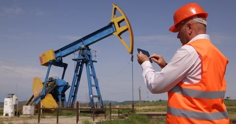 Engineer Working In Extracting Oil Industry Use Tablet Wireless Communication  Stock-Footage 102261421