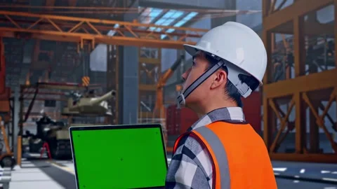 Engineer Working On A Green Screen Lapto... | Stock Video | Pond5
