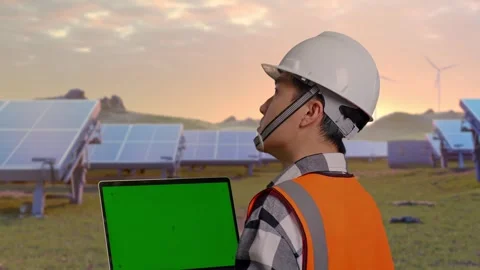 Engineer Working On A Green Screen Laptop at Energy Farm Stock Footage 331025133