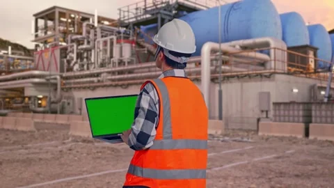 Engineer Working On A Green Screen Laptop at Gas Plant Stock Footage 337761012