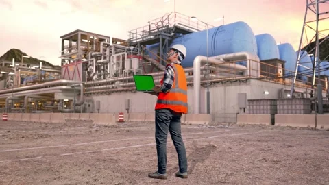 Engineer Working On A Green Screen Laptop at Gas Plant Stock Footage 337762284