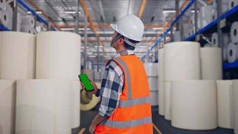 Engineer Working On A Green Screen Smartphone at Polymer Plant Stock Footage 334525105