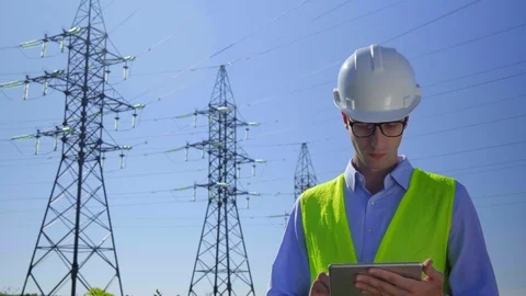 Engineer working on High-voltage tower, Check the information on the tablet Stock Footage 114557780