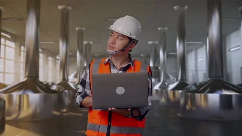 Engineer Working On A Laptop at Beer Plant Stock Footage 332544565