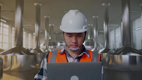 Engineer Working On A Laptop at Beer Plant Stock Footage 332545447
