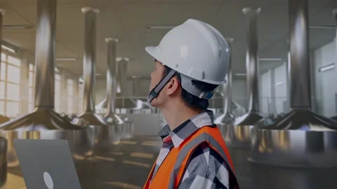 Engineer Working On A Laptop at Beer Plant Stock Footage 332545699