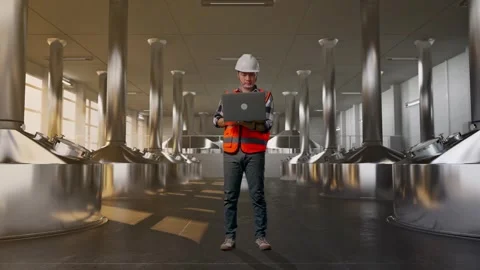 Engineer Working On A Laptop at Beer Plant Stock Footage 332545921
