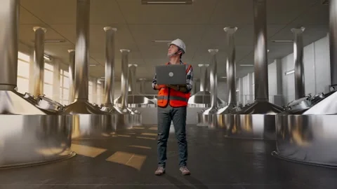 Engineer Working On A Laptop at Beer Plant Stock Footage 332545923